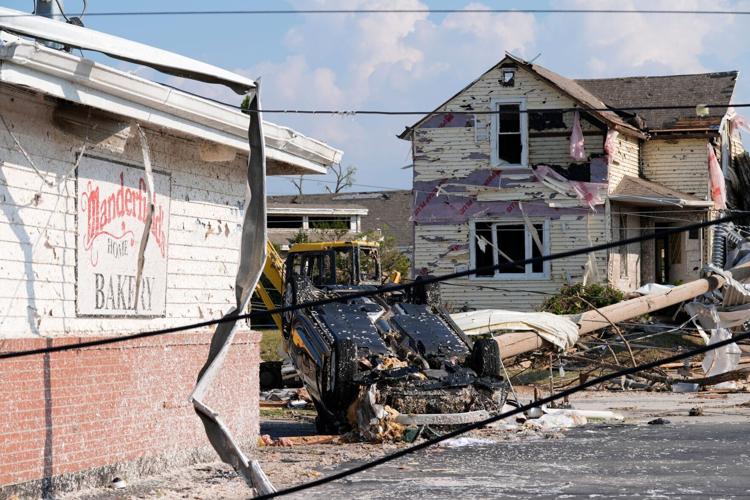 A car is flipped over at Manderfield’s Home Bakery following severe weather, including a tornado Monday, July 27, 2026, in