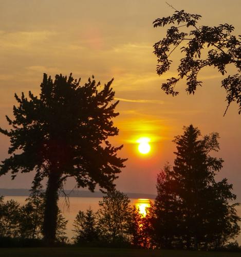 Sun rises through smoke