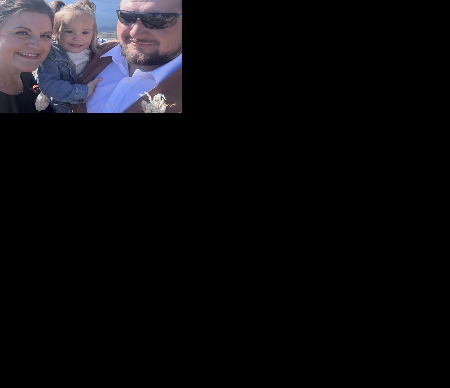 Sam with granddaughter and son