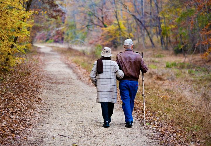 Older couple walking in woods