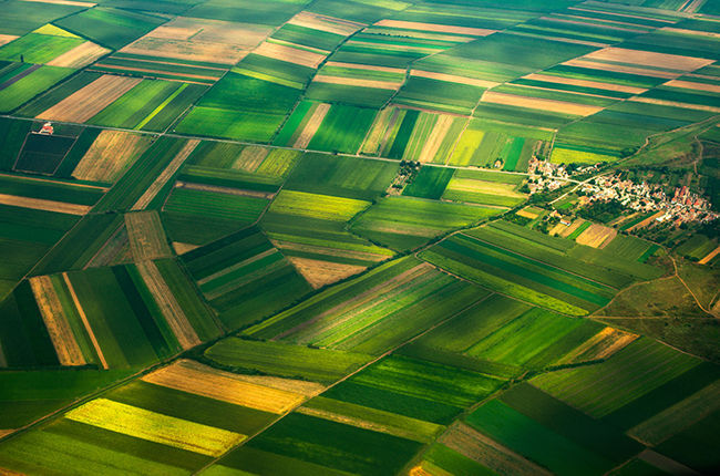 Aerial of farmland near housing development