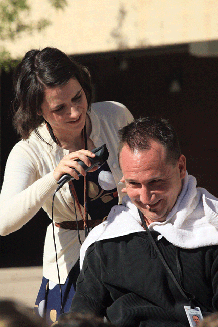Students collect canned food to give their teacher a Mohawk