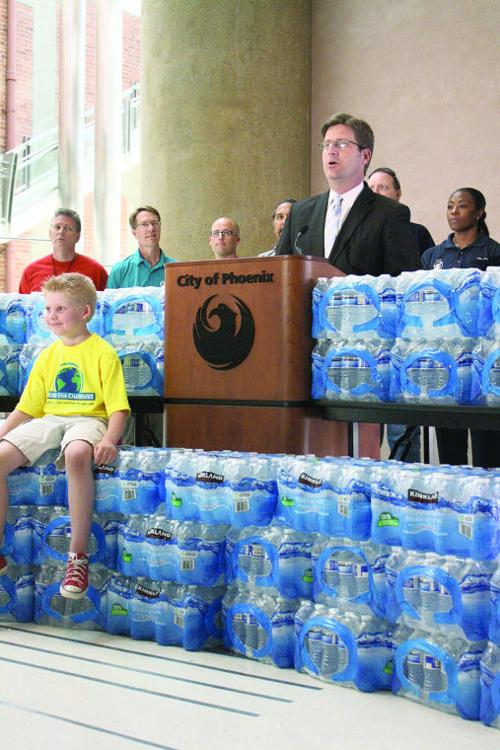 Greg Stanton makes a call for water