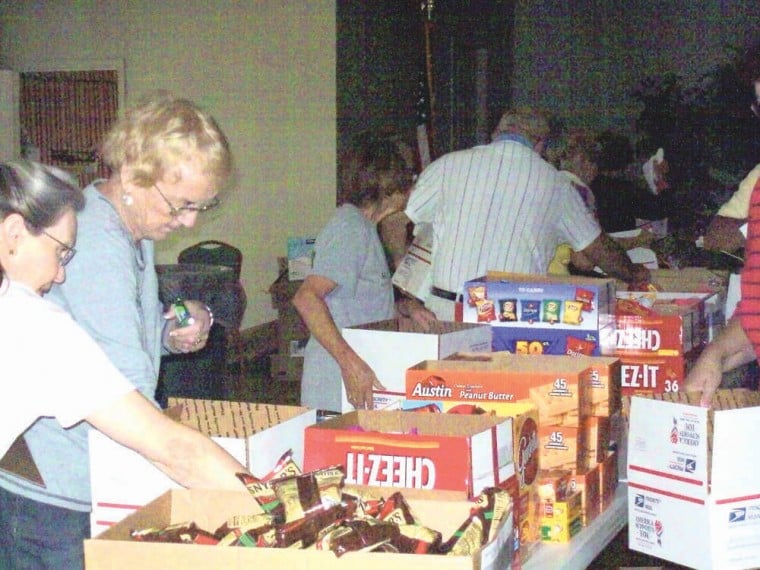 ARC members preparing care boxes