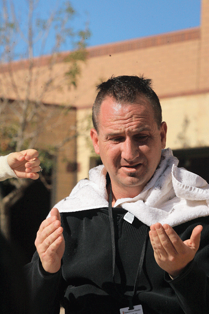 Students collect canned food to give their teacher a Mohawk
