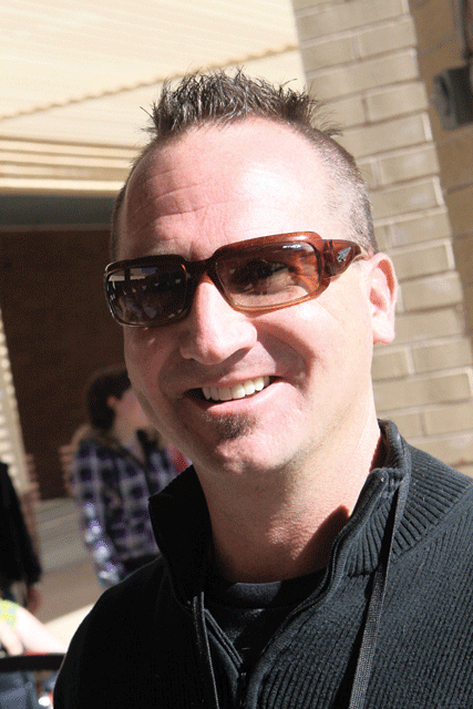 Students collect canned food to give their teacher a Mohawk