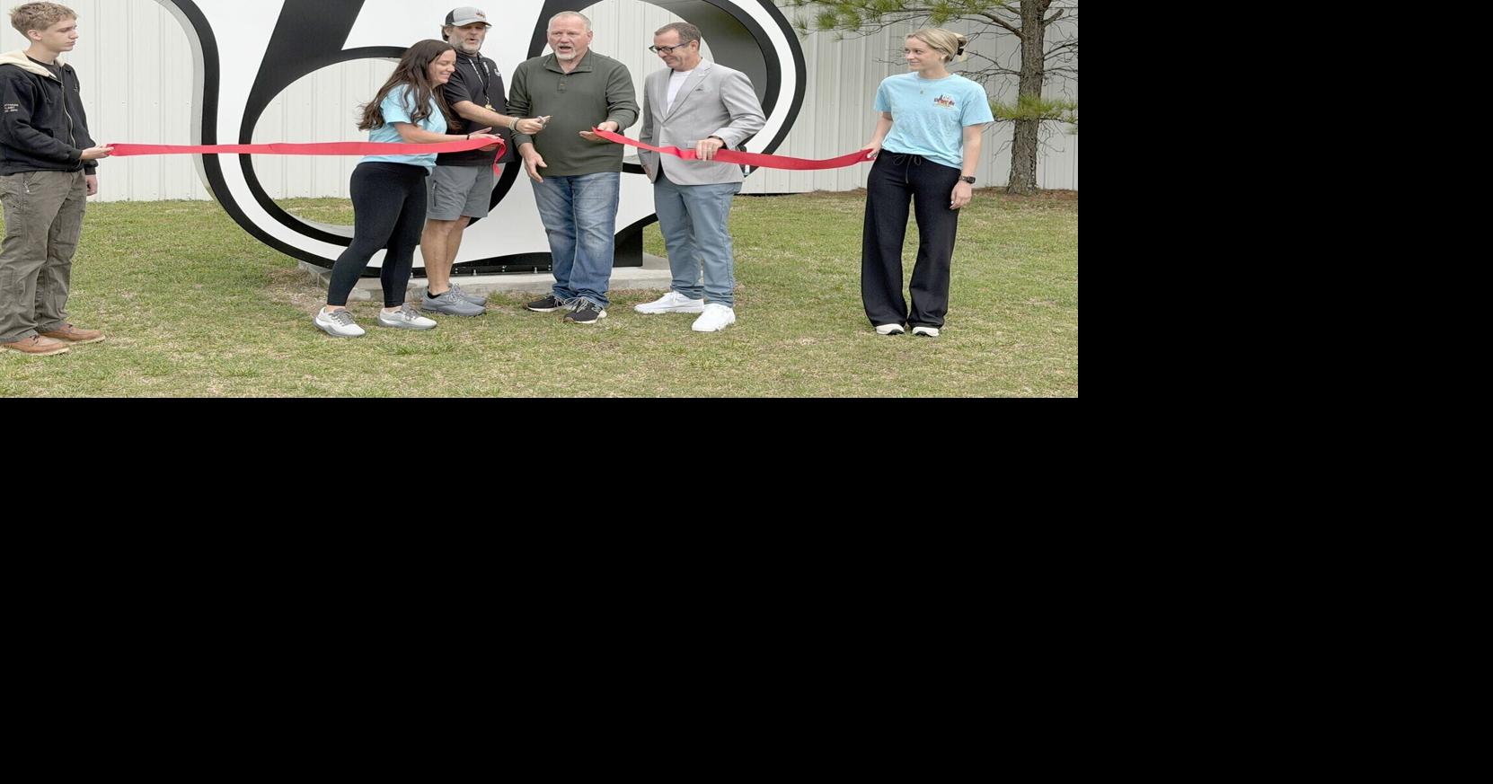 Theatre owners, tourism officials dedicate official Centennial Route 66 shield