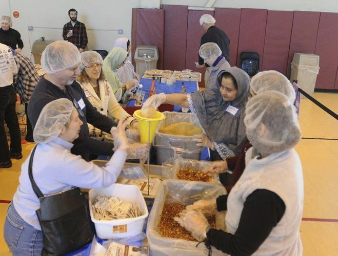 Interfaith Volunteers Pack Meals For