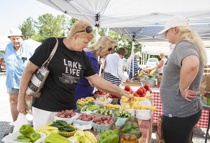 PRODUCE SHOPPING Umphrey Farms among vendors selling items at weekly