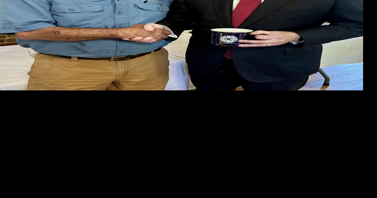 Neil Breiner presented Don Killingsworth an Exchange Club mug.