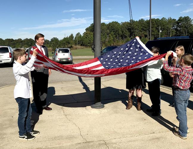 Rogers delivers flag to Munford Elementary, talks potential budget cuts