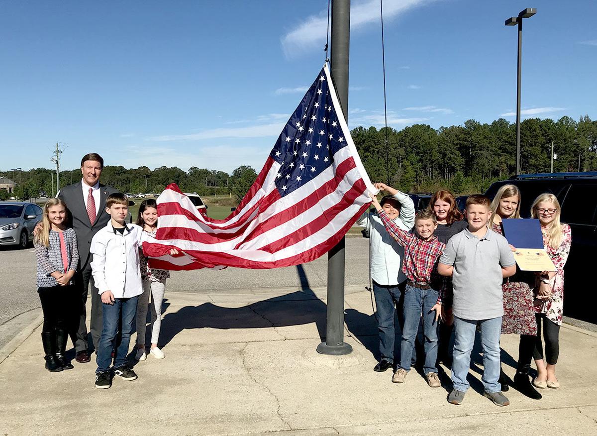 Rogers delivers flag to Munford Elementary, talks potential budget cuts