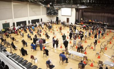 In Oxford, people line up for COVID vaccines, imagine life ahead