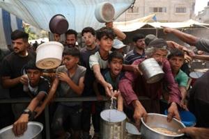 Gaza civil defence says Israeli fire kills 26 near two aid centres