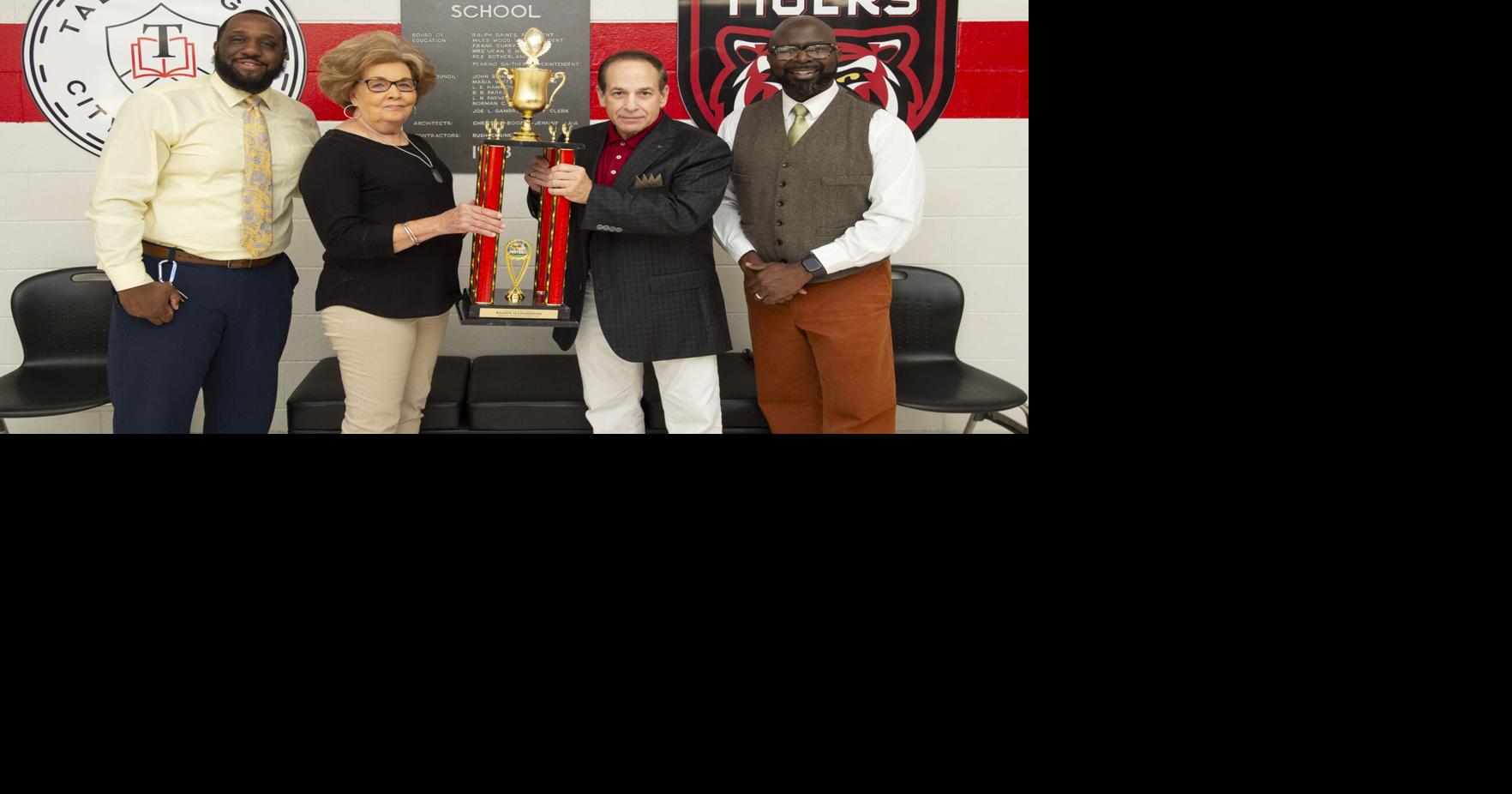 Trophy life  Symbol of ’75 success given secure home at high school