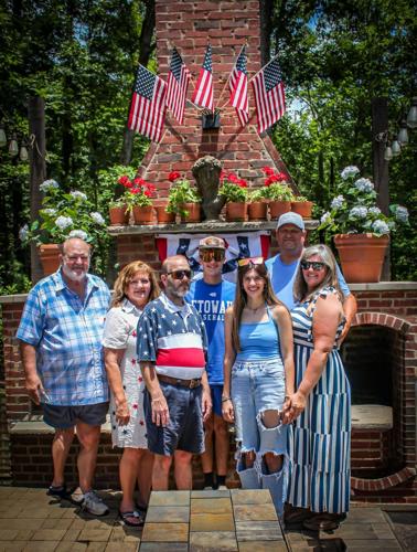 Phillip Sides’ friends and family members gather