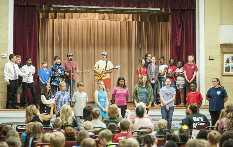 Singer/songwriter Ben Myrick performs at R.L. Young Elementary School
