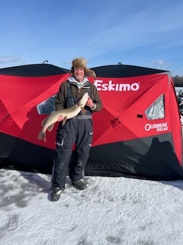 An Eskimo Ice Fishing Tent and Tip-ups Set for Northern Pike