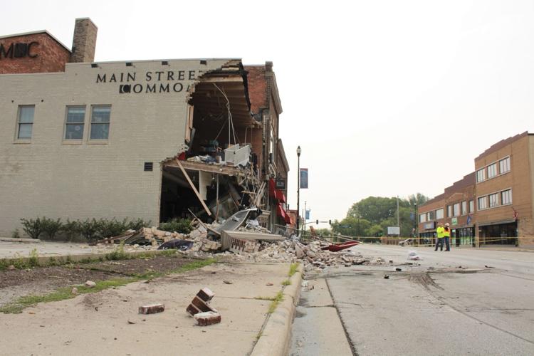 Minivan strikes building, leaving roof sagging and turning much of its ...