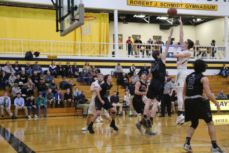 Cane boys hoops squad runs and guns, beats the Spooner Rails