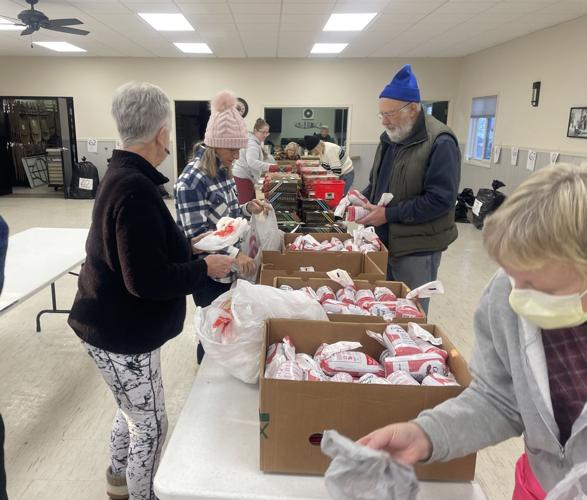 Lions clubs gather to provide food, gifts for families Local
