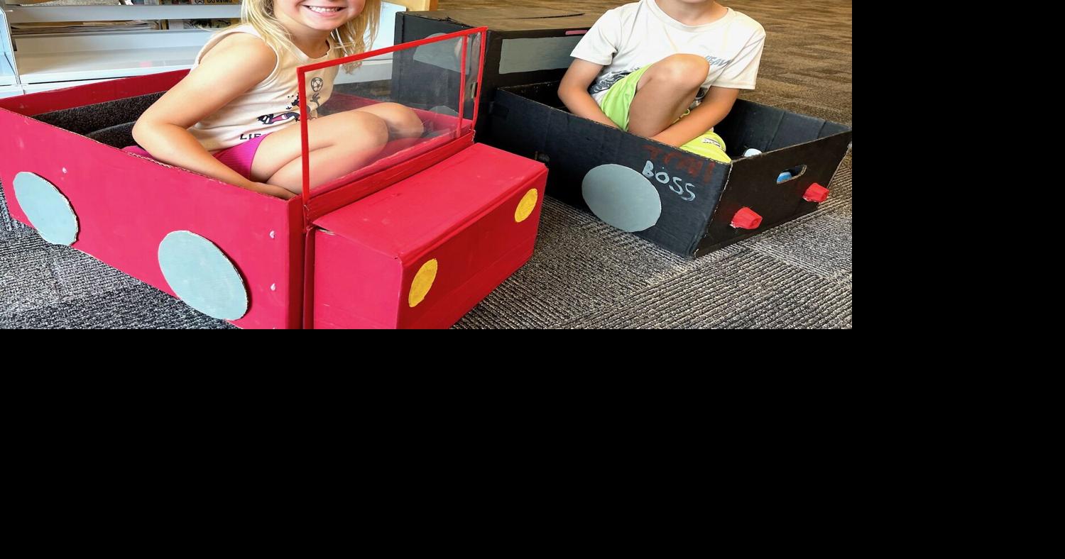 Kids create drive-in movie cars. watch movie at the library
