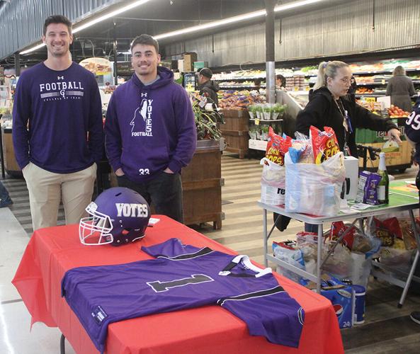C Of I Football Players Greet Shoppers At Red Apple Anniversary Sale C of i football players greet shoppers at red apple anniversary sale