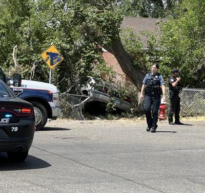 High-speed chase ends with vehicle crashing through fence, hitting tree