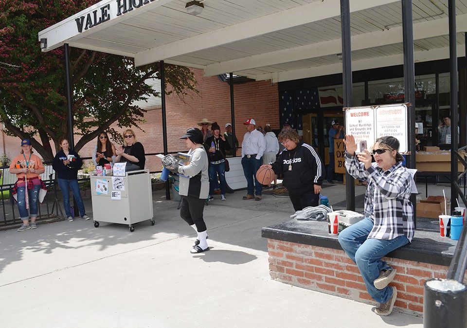 Cheering for students as they arrive