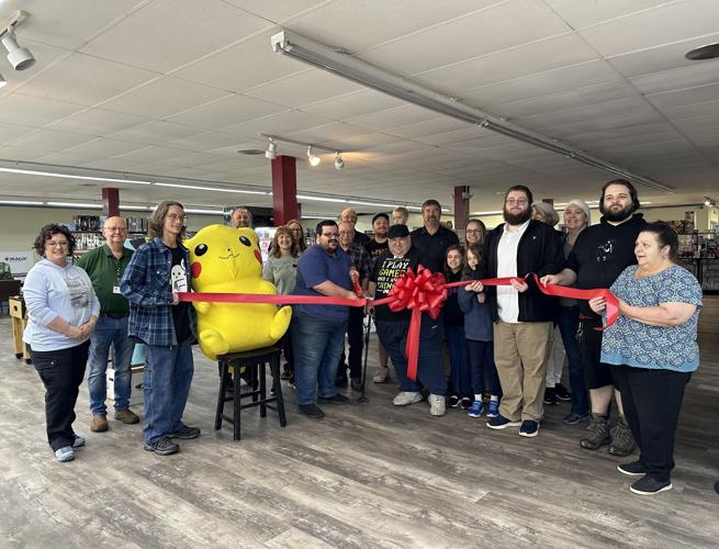 Chamber Kitchen Table Games & Bistro with ribbon cutting