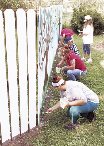Volunteers prepare for Art in the Park