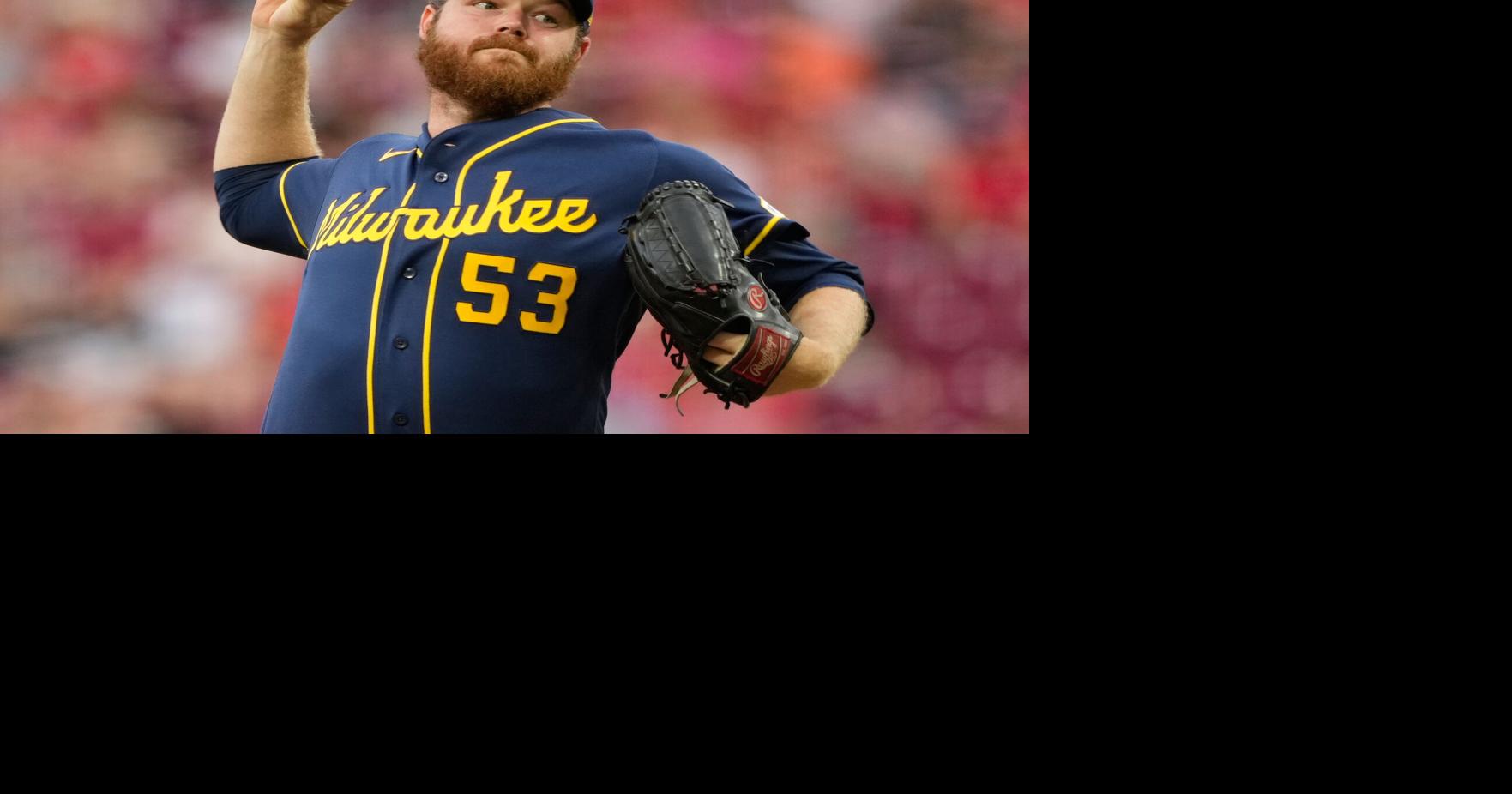 Woodruff's stellar return and Ortiz's sacrifice fly in 10th lift Brewers to 2-1 win over Reds