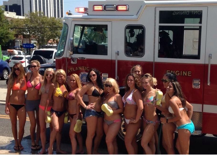 Bikini car wash fundraiser at Vagabond Just For Fun