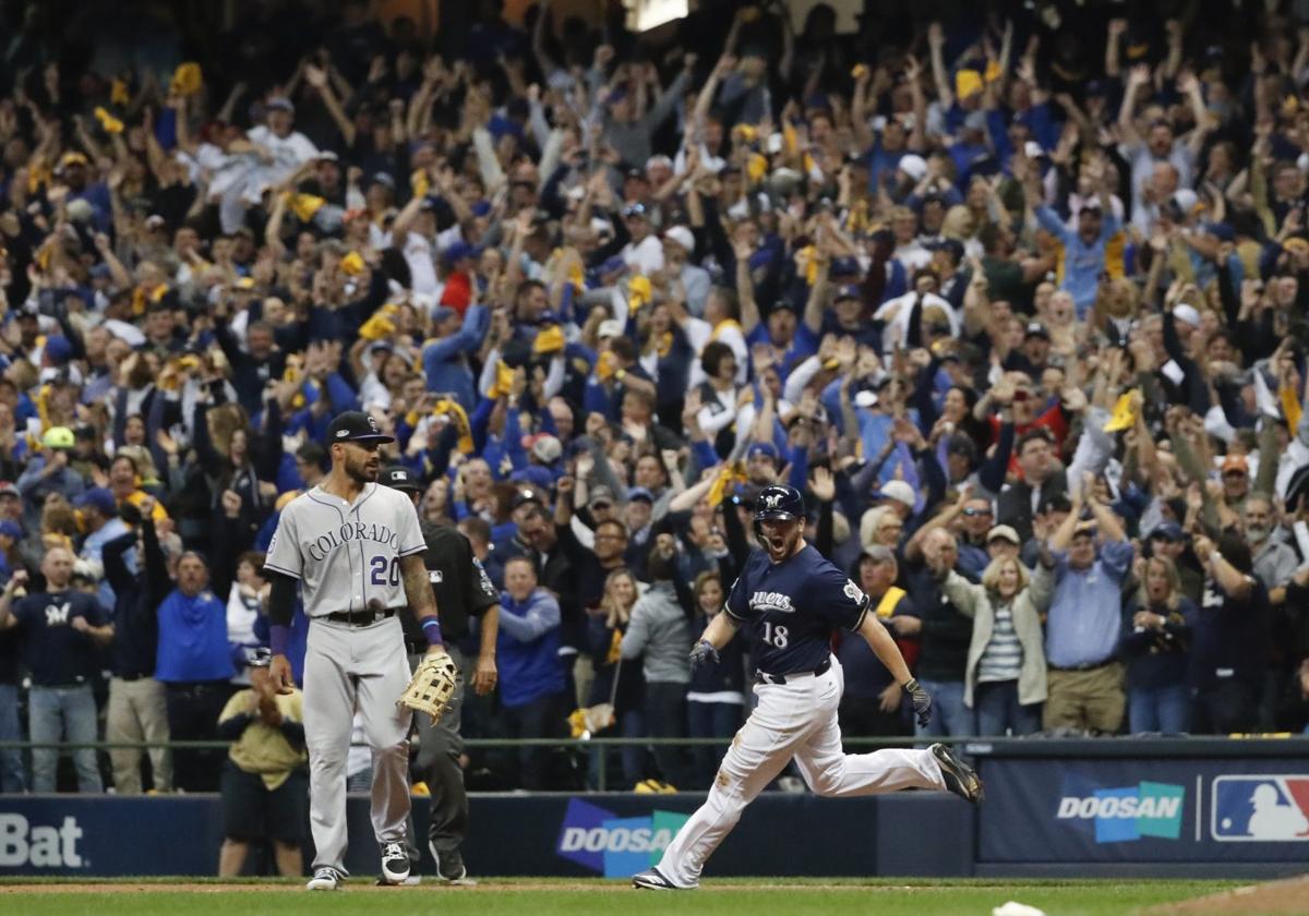 Mike Moustakas scores Christian Yelich in 10th, Brewers top Rockies in NLDS  opener