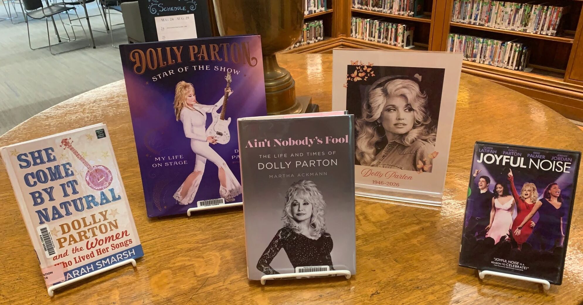 Local library staff and families celebrating Dolly's legacy during the Imagination Library milestone