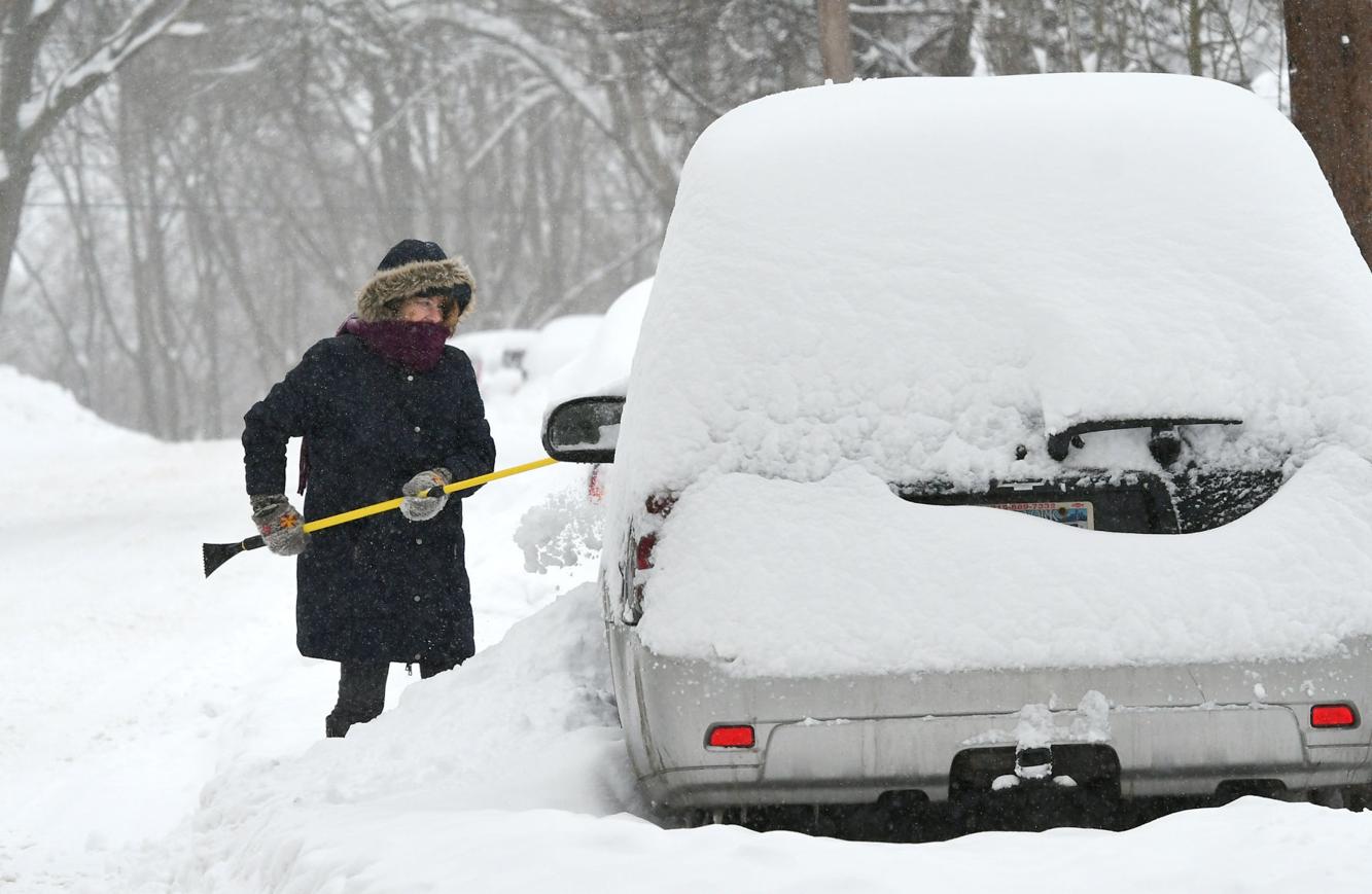 Gallery Residents dig out after storm drops more than foot of snow in