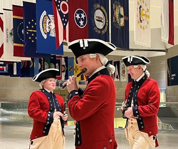 A member of the U.S. Army Old Guard Fife and Drum Corps rehearses off-stage before a performance at an event unveiling semiquincentennial coin designs, The ceremony was held Dec. 10 at the National Constitution Center in Philadelphia.
