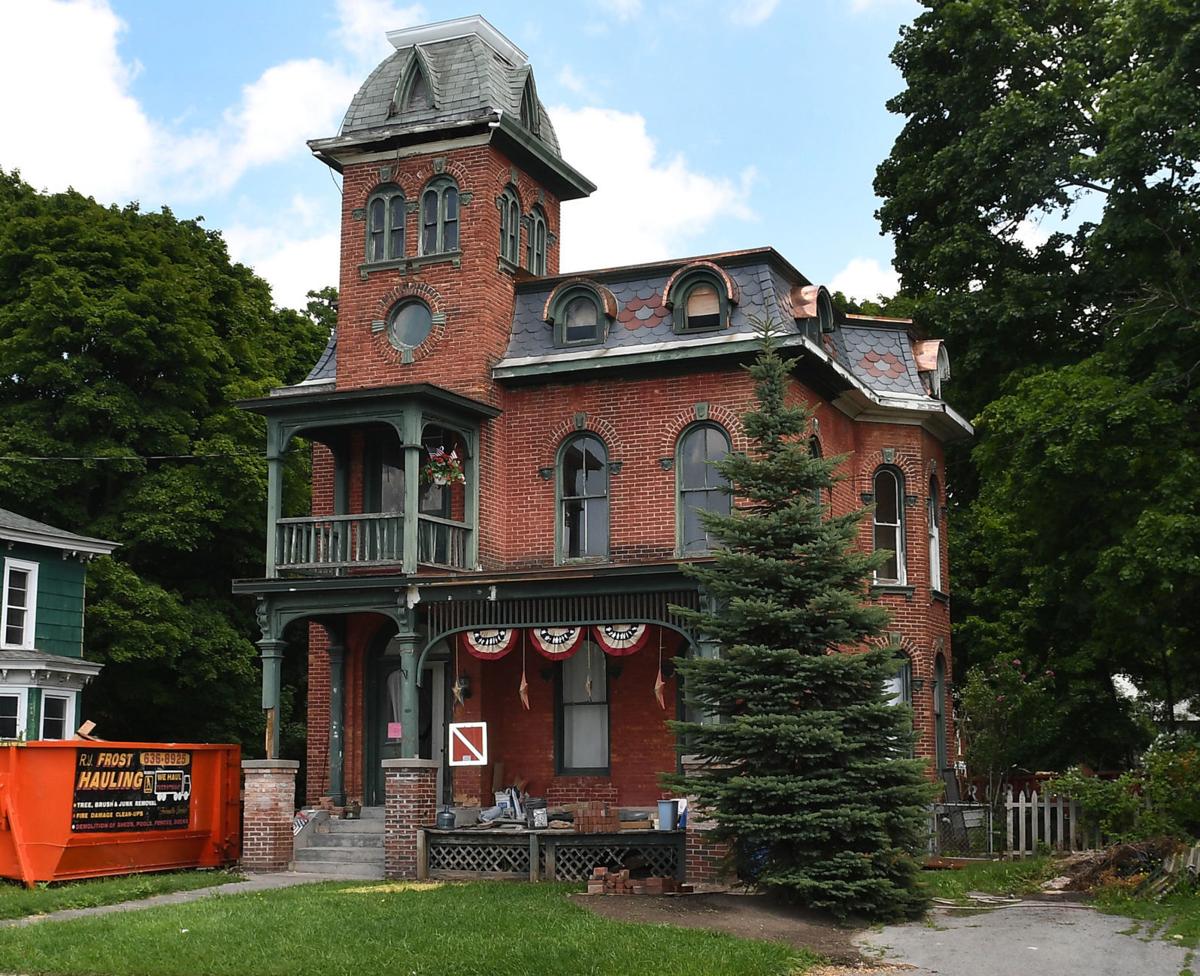 The Candlelight House Woman restoring historic Auburn home