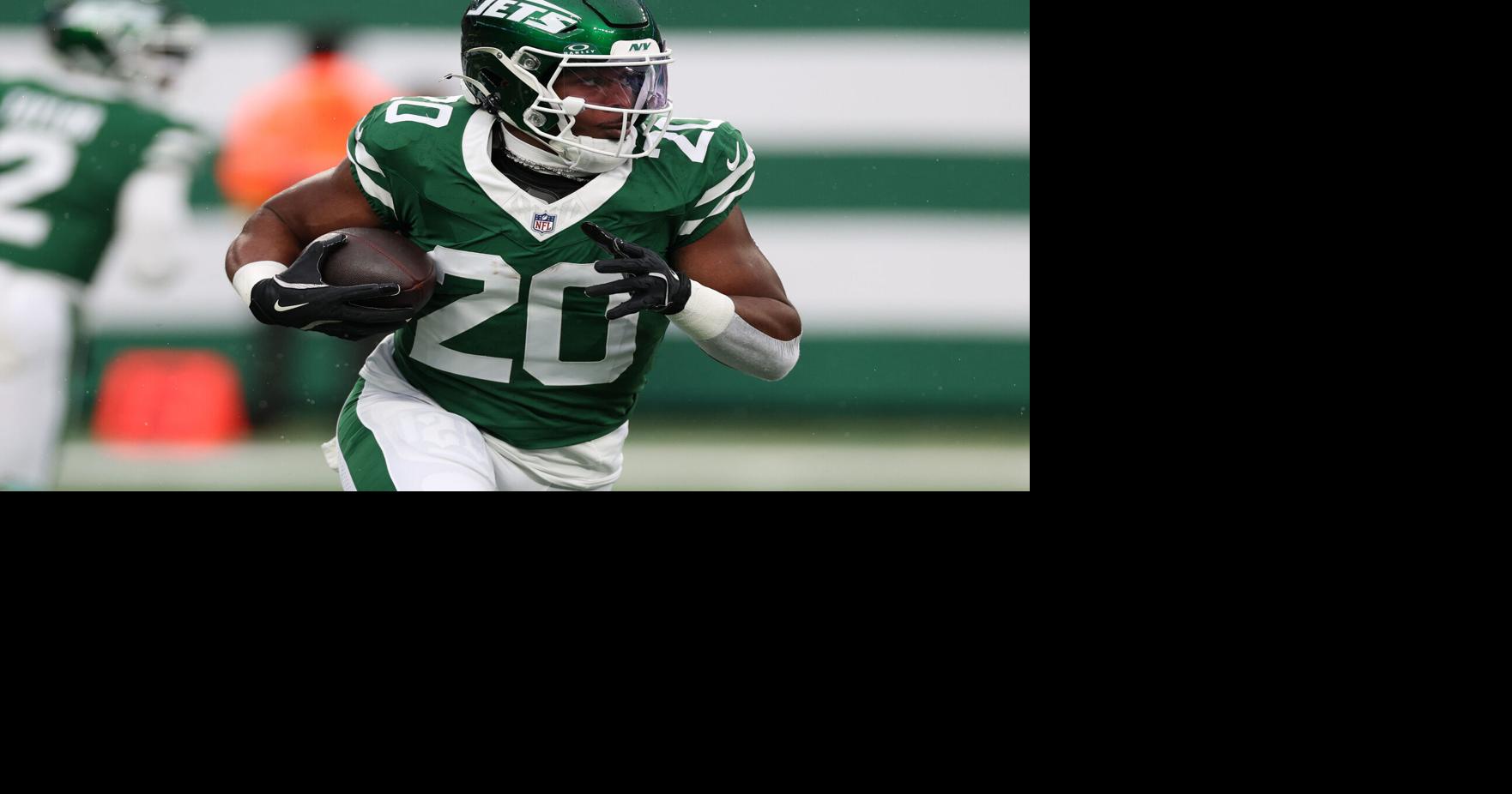 New York Jets running back Breece Hall (20) rushes the ball against the Atlanta Falcons during the first half at MetLife Stadium.