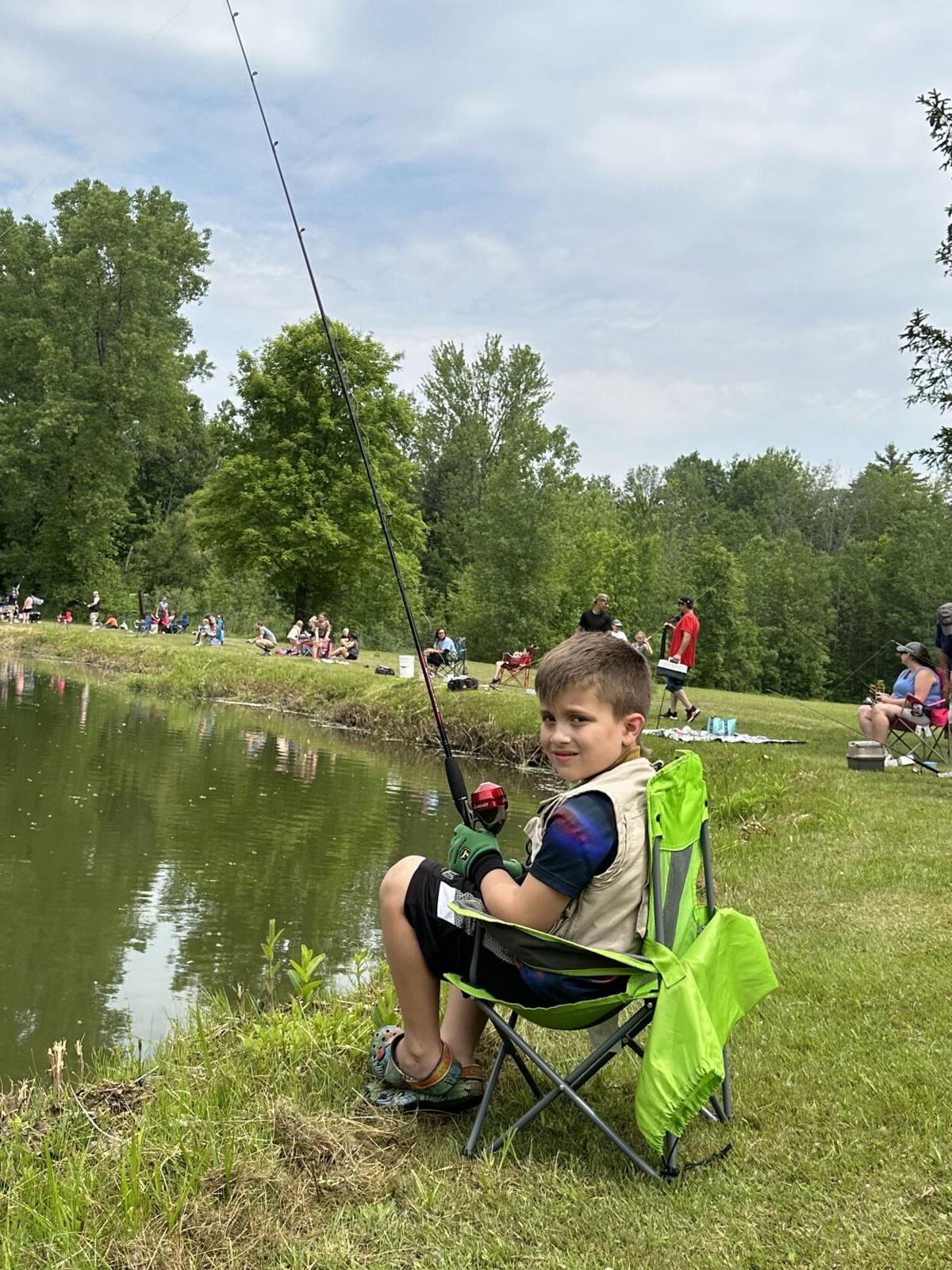 Families gather around the pond for Falcon Sportsmen's fish derby