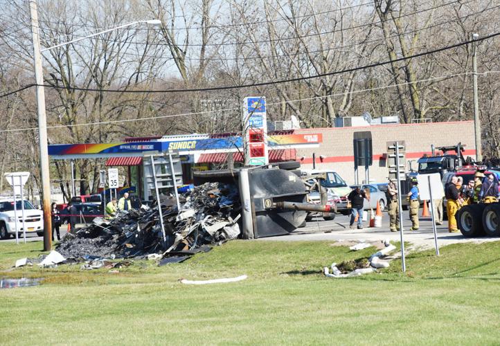 Shredding truck overturns in Fleming traffic circle on Route 38