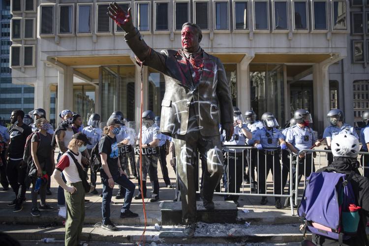 Photos: A look at statues toppled, damaged, questioned in ...