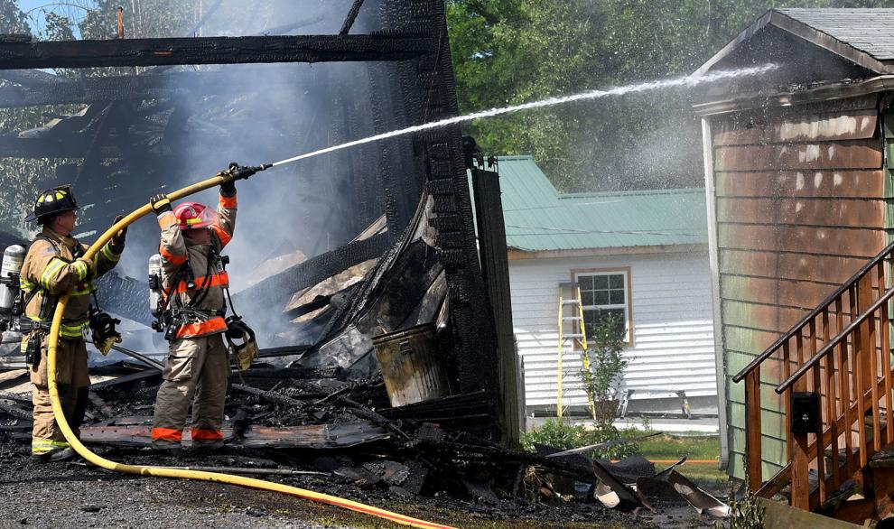 Firefighters from 4 counties battle garage, house fire in Cato