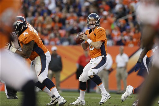 Peyton Manning breaks more records, Broncos clinch AFC