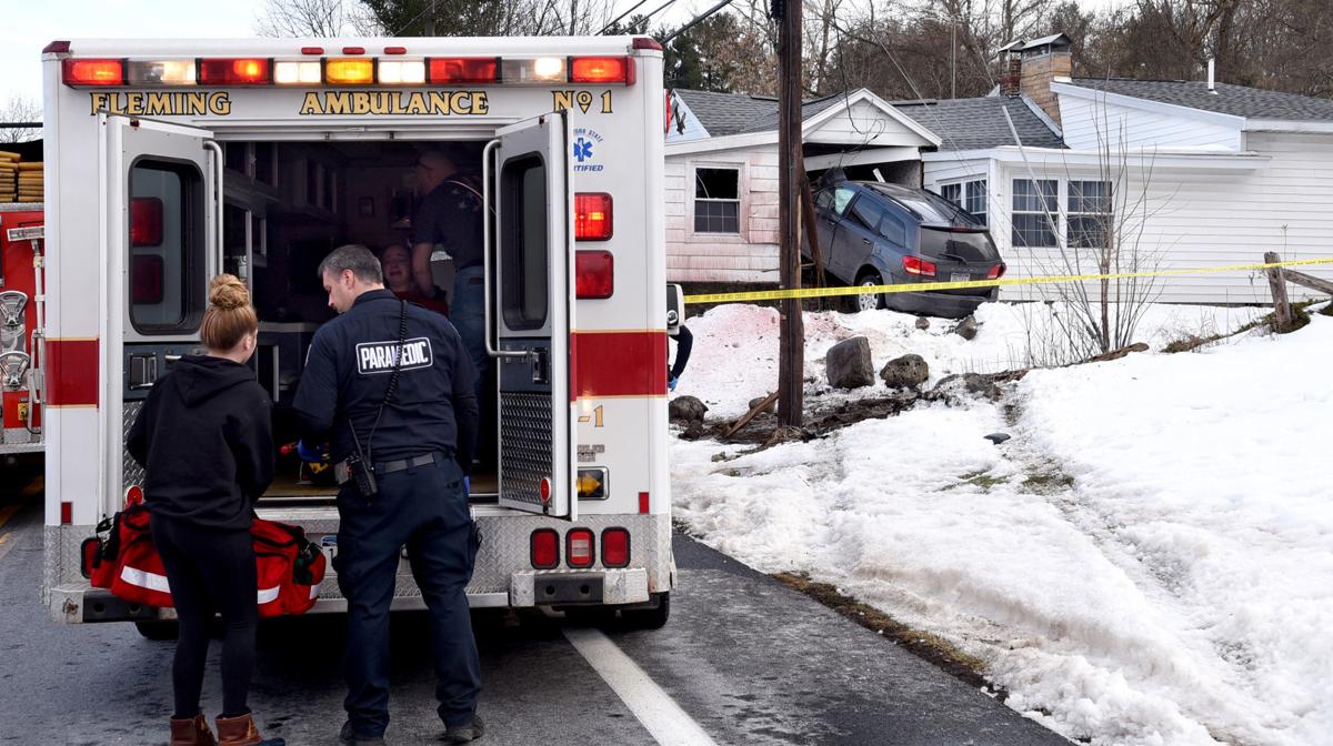 UPDATED Two people injured when vehicle crashes into house in Fleming