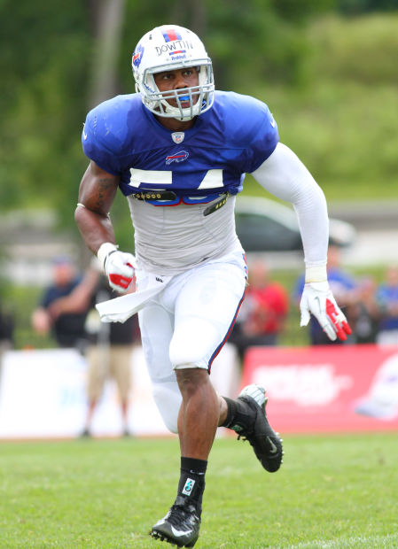 Buffalo Bills' Kyle Williams pulls on his jersey during an NFL football  training camp in Pittsford, N.Y., Sunday, July 31, 2011. (AP Photo/David  Duprey Stock Photo - Alamy