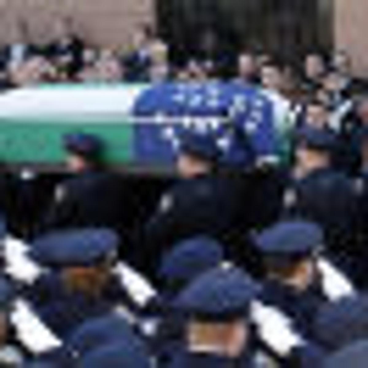 Fellow New York City Police Officers Salute Fallen Comrade