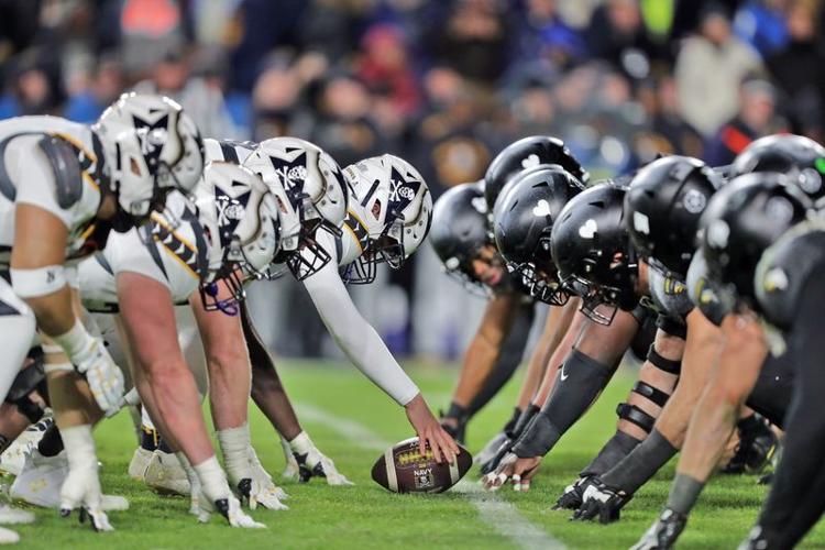 Dec 14, 2024; Landover, Maryland, USA; Army and Navy line up at the line of scrimmage during the second half of the the 125th Army-Navy game at Northwest Stadium. Mandatory Credit: Danny Wild-Imagn Images
