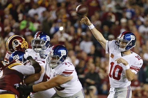 New York Giants quarterback Eli Manning throws a pass against the  Washington Redskins in the first