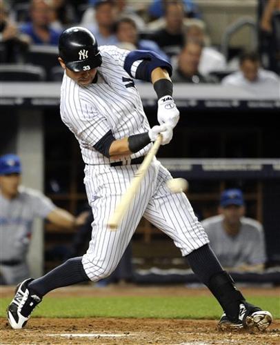 New York Yankees Nick Swisher hits a solo homer in the ninth